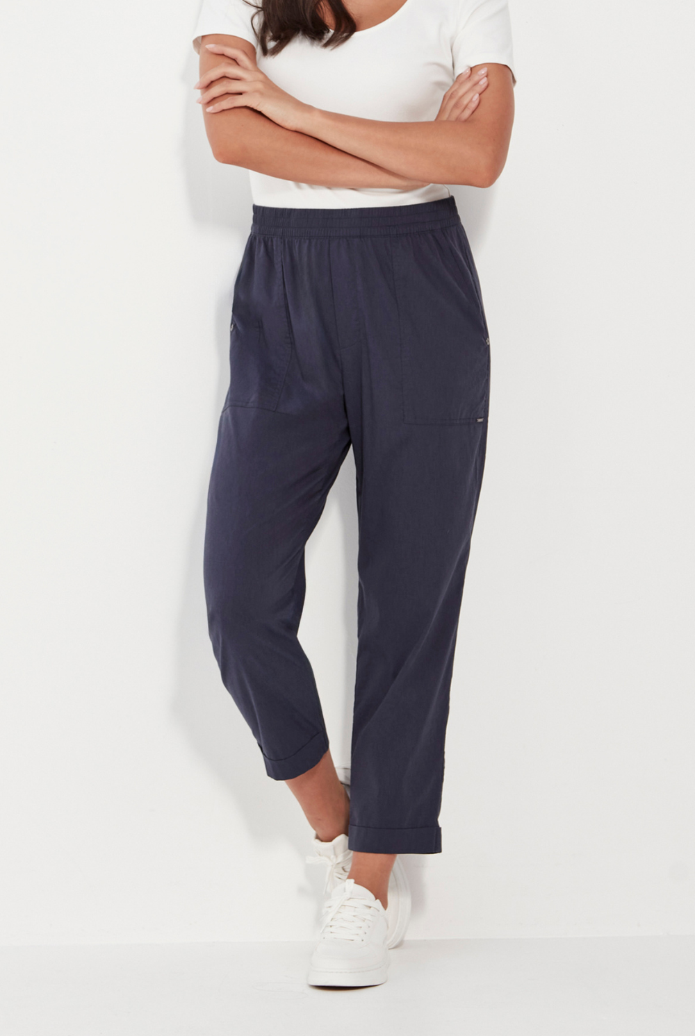 Woman wearing a white top and Verge Acrobat Essex Pant Denim Marle. Now available online at Silvermaple Boutique