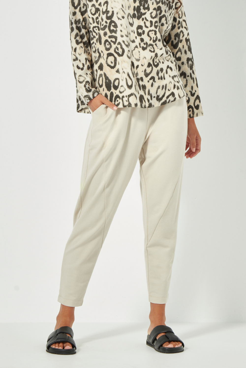 Women wearing a pair of Civic Pants, Cashew by Verge. Shop online now at Silvermaple Boutique.