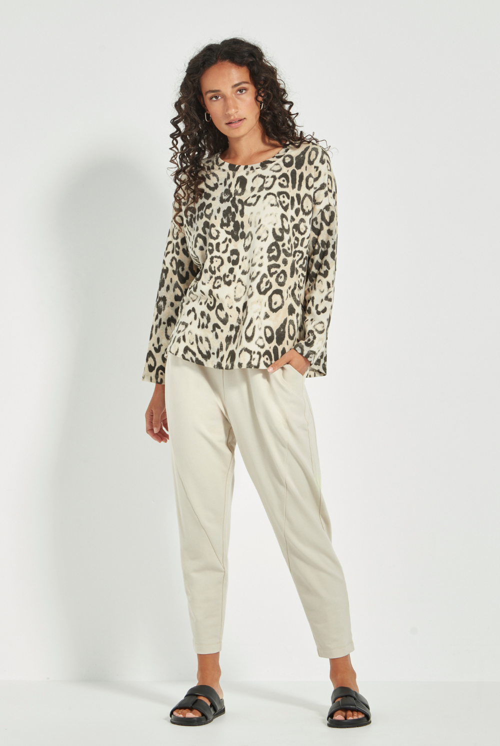 Women wearing a pair of Civic Pants, Cashew by Verge. Shop online now at Silvermaple Boutique.