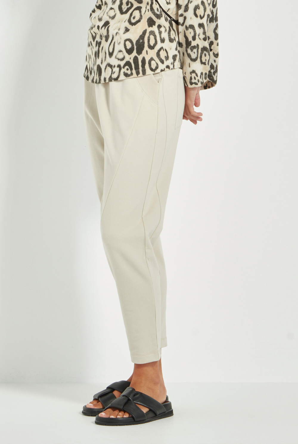 Women wearing a pair of Civic Pants, Cashew by Verge. Shop online now at Silvermaple Boutique.