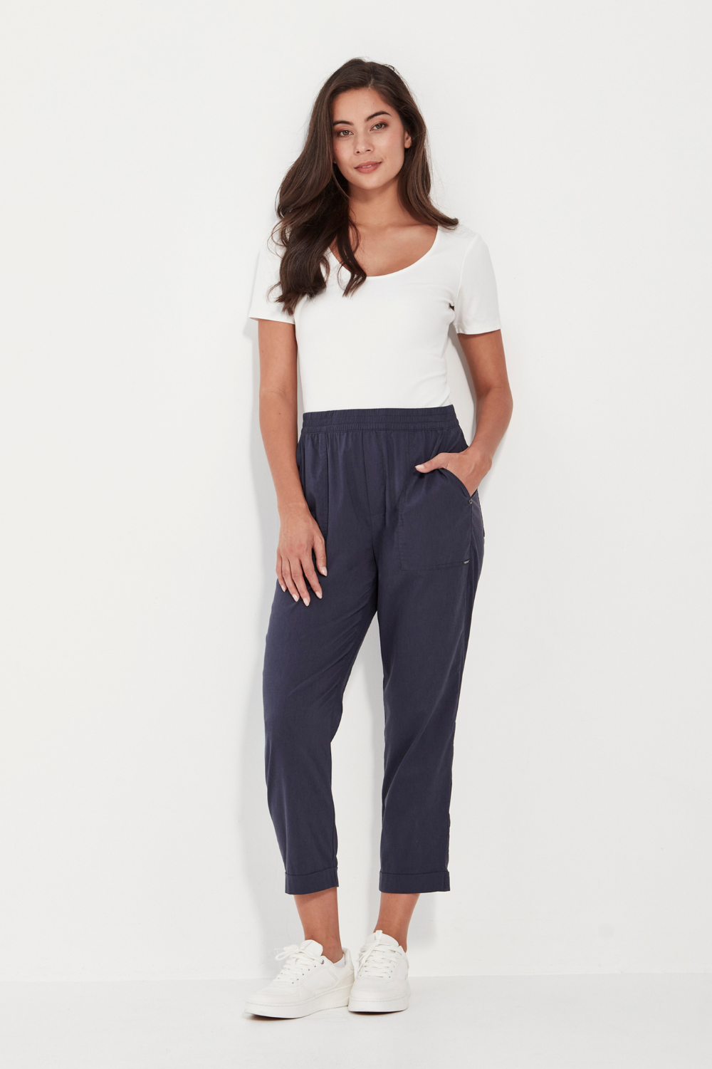 Woman wearing a white top and Verge Acrobat Essex Pant Denim Marle. Now available online at Silvermaple Boutique